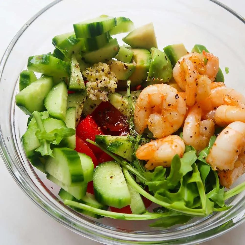 Fresh arugula avocado shrimp salad for weight loss