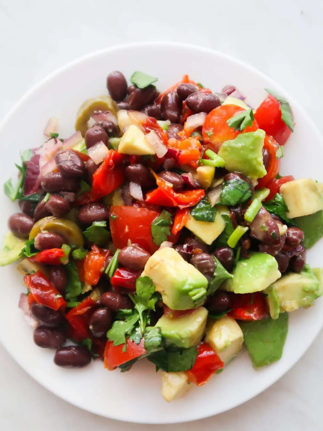 Simple avocado black bean salad without corn is a great vegan lunch idea or a fast side dish! You can make this gluten-free vegan salad…