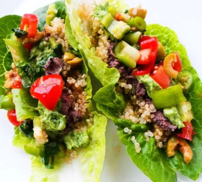 Vegan lettuce wraps with a spicy bean dip, avocado, quinoa and vegetables! Satisfying and light vegan dinner recipe!