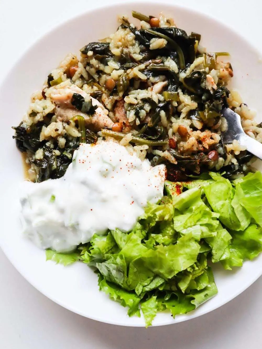 This simple chicken, spinach and rice recipe is packed with protein and flavor and is solid for dinner! It's comfort food, but healthy.