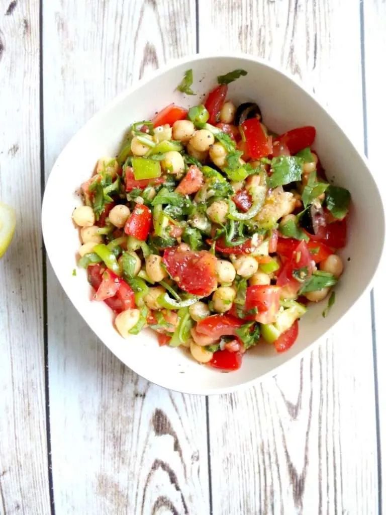 Tomato, Garlic and Chickpea Salad Recipe - Vegan, Gluten-Free. Try this satisfying healthy chickpea salad for lunch or dinner! It’s…