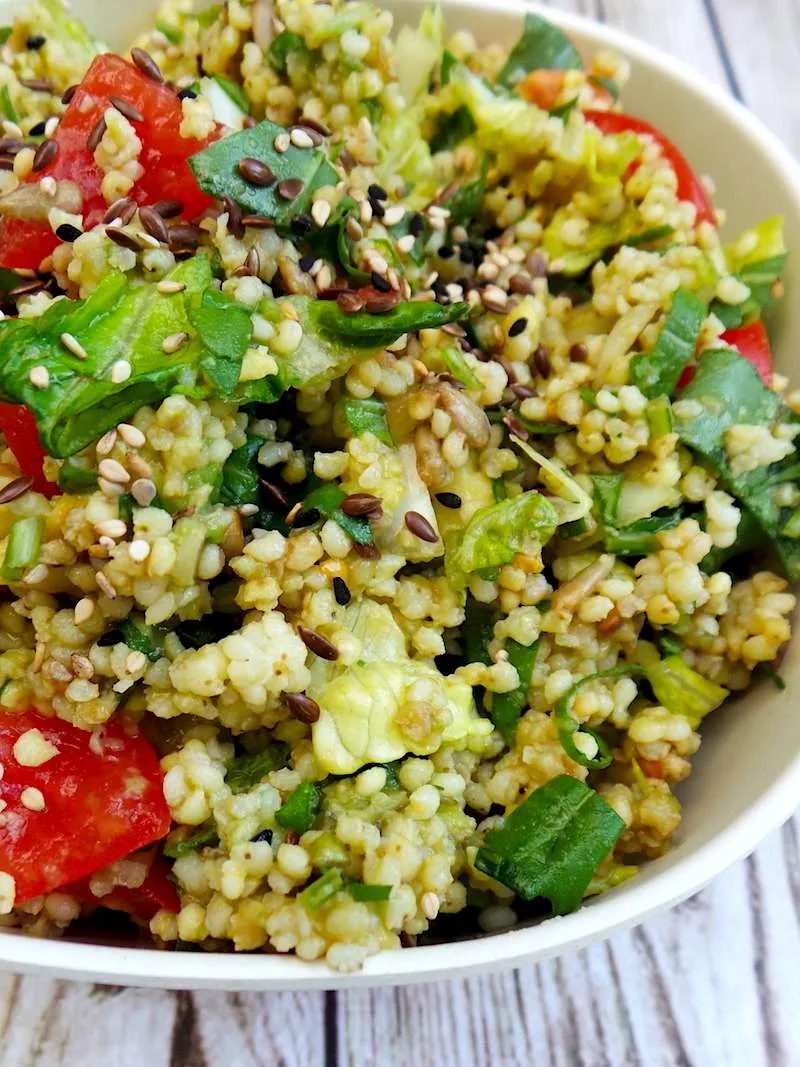 Healthy summer salad with avocado and millet! This makes a filling, but light healthy lunch recipe that everyone will love! |