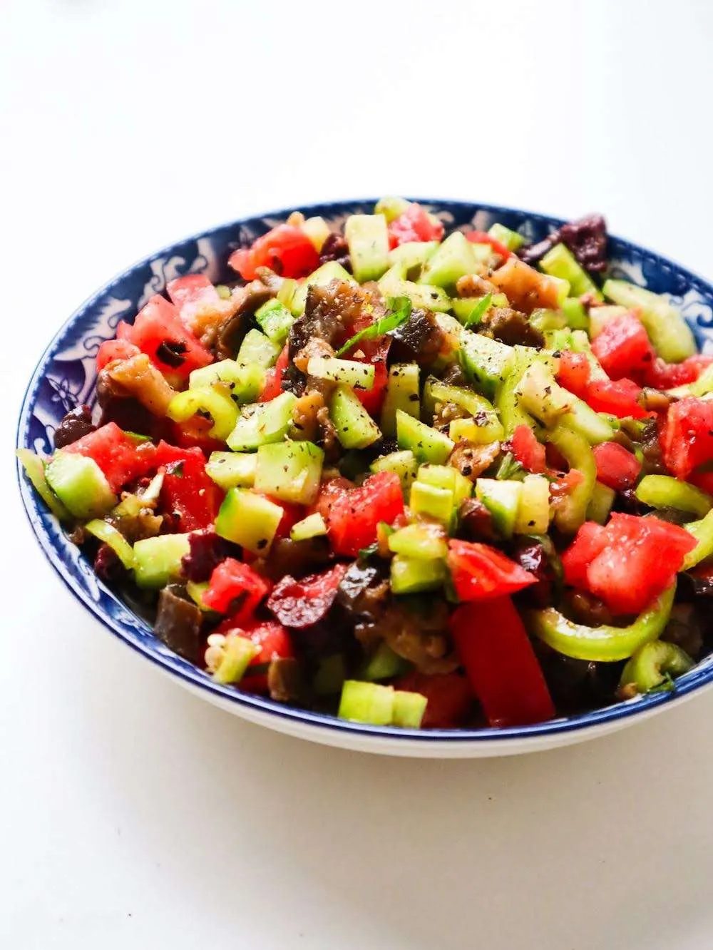 This simple high-fiber eggplant salad with tomatoes and cucumbers is the solid vegetable side for your preferred protein!
