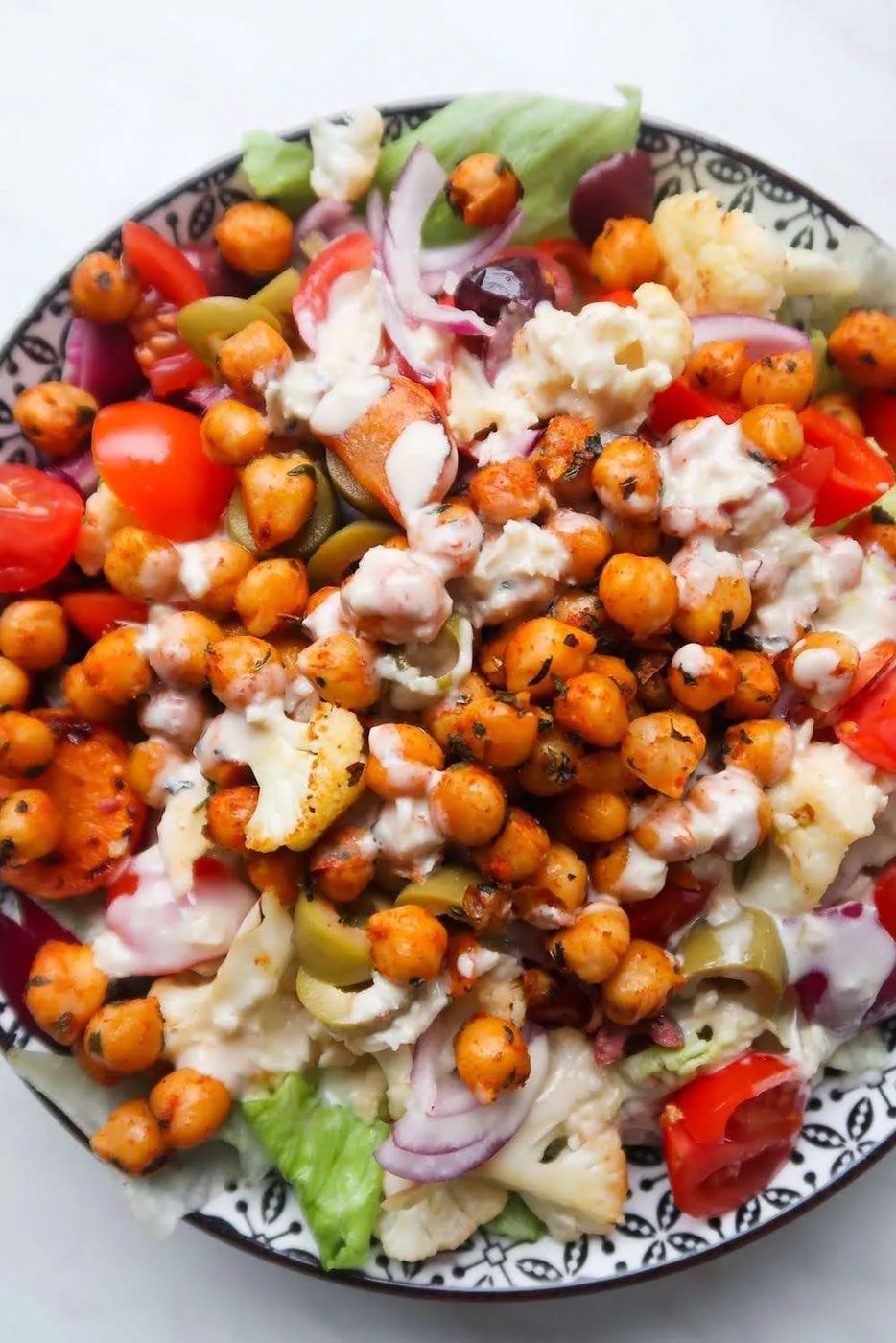 This Mediterranean roasted chickpea salad is flavorful, healthy and simple to make - a reliable healthy lunch idea with vegetables, canned…