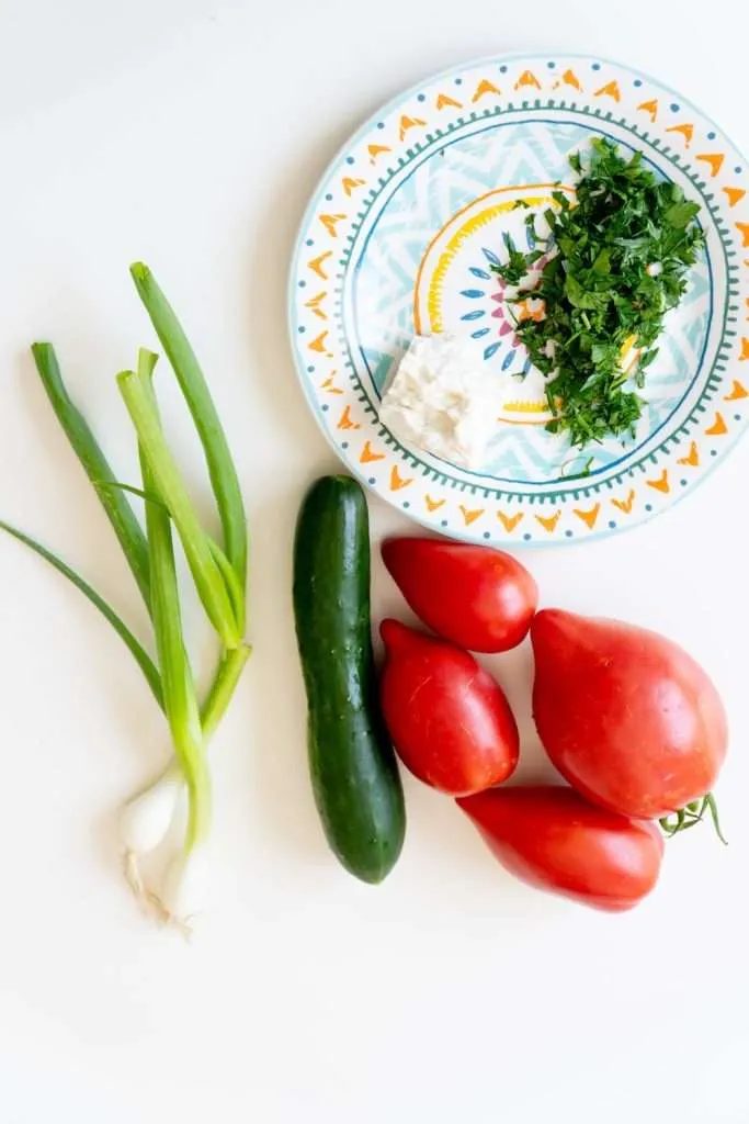 This is a reliable tomato cucumber feta salad! It also happens to be our favorite lunch during summer, you can not beat it on a hot day.