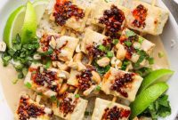 Umami Chili Crisp Tofu Skewers with Cashew Crunch