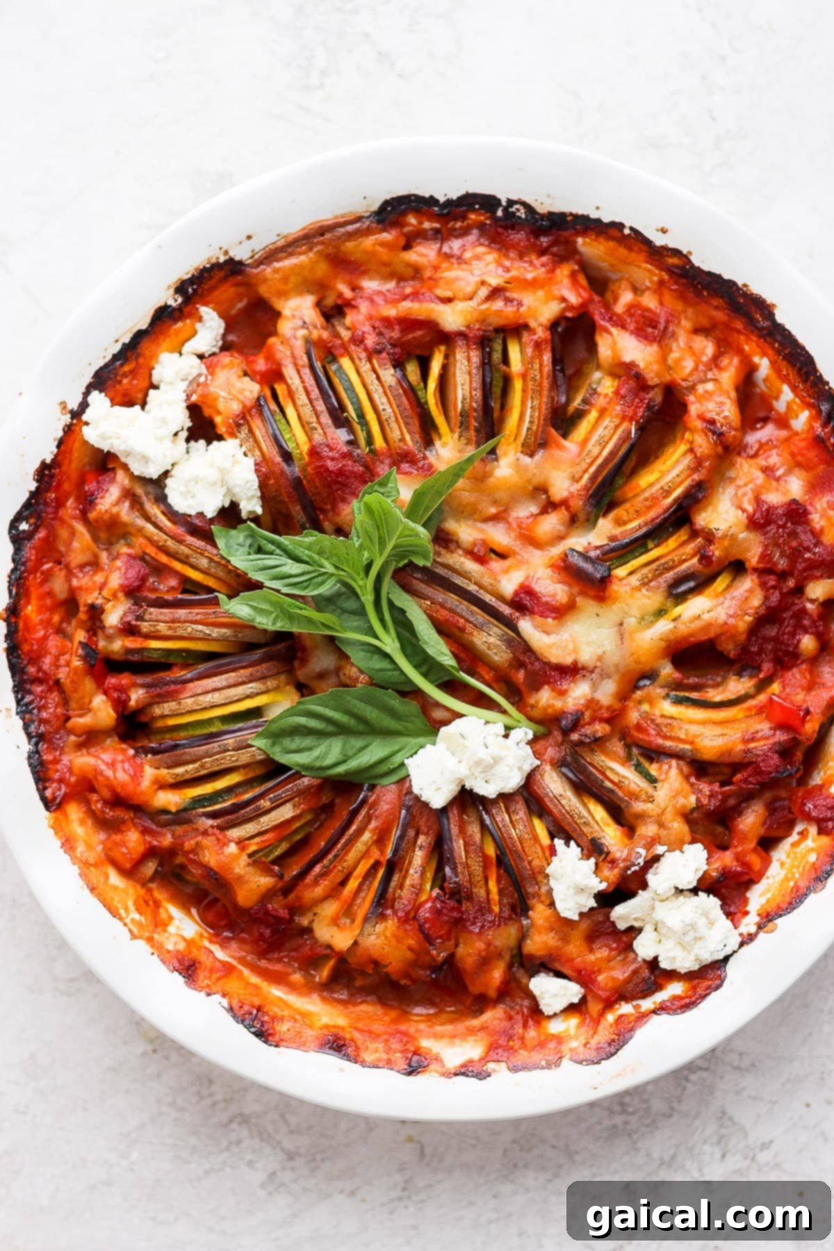 Beautifully arranged Ratatouille in a round baking dish, ready to be served.
