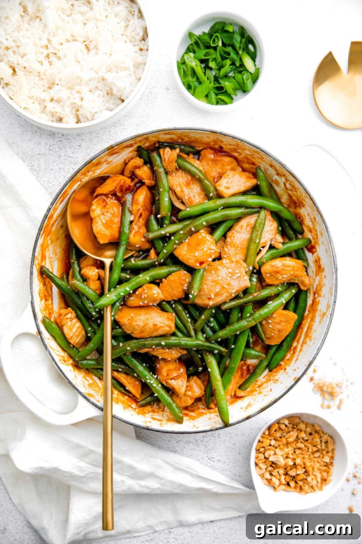 Easy and Healthy Kung Pao Chicken Stir Fry in Pan Delicious Kung Pao Chicken stir-frying in a large pan, coated in a rich sauce with green beans and ready to be served