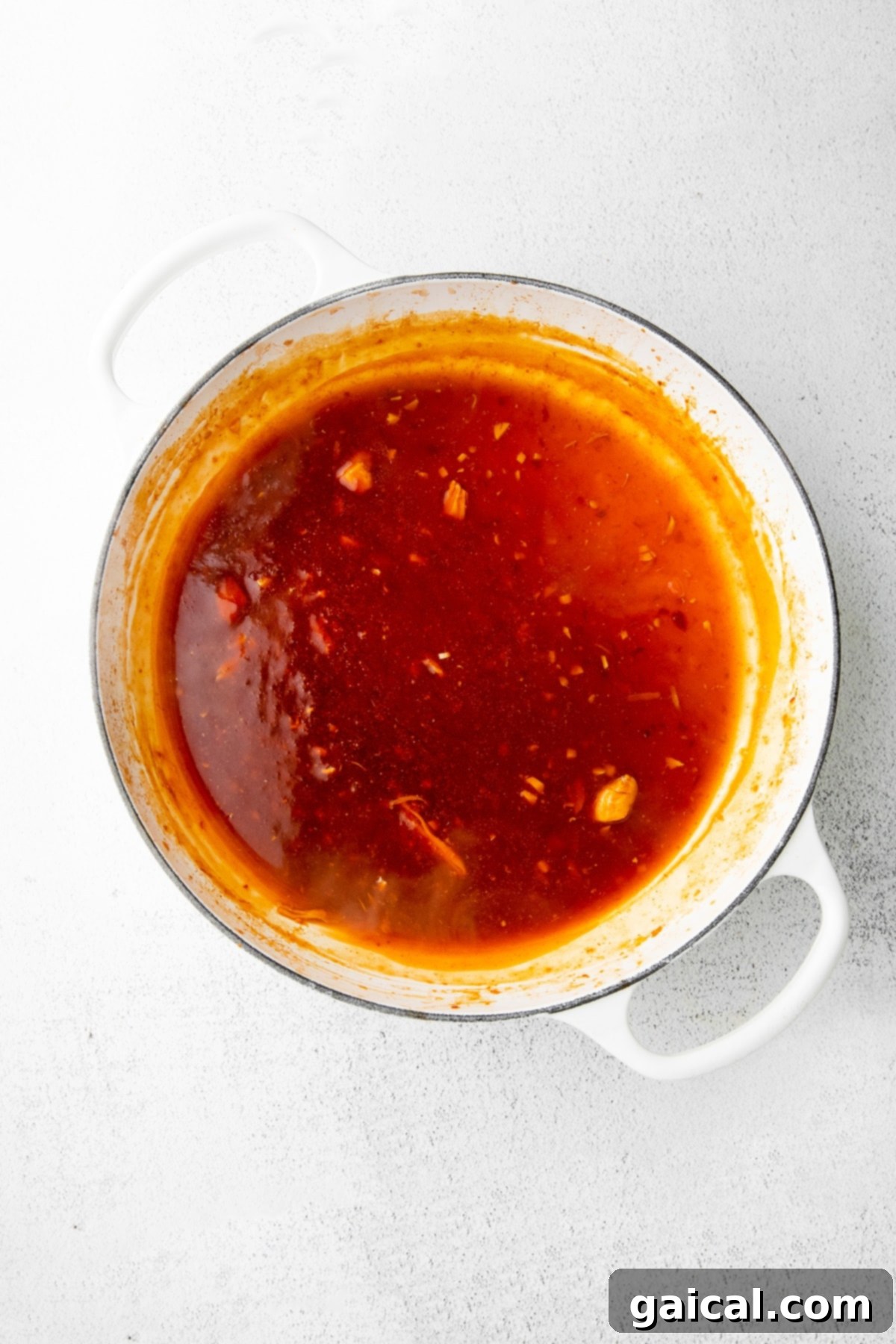 The Final Touch: Kung Pao Sauce Perfectly Coating Chicken and Green Beans Kung Pao Chicken and green beans simmering in a large skillet, beautifully coated in the thick, glossy sauce