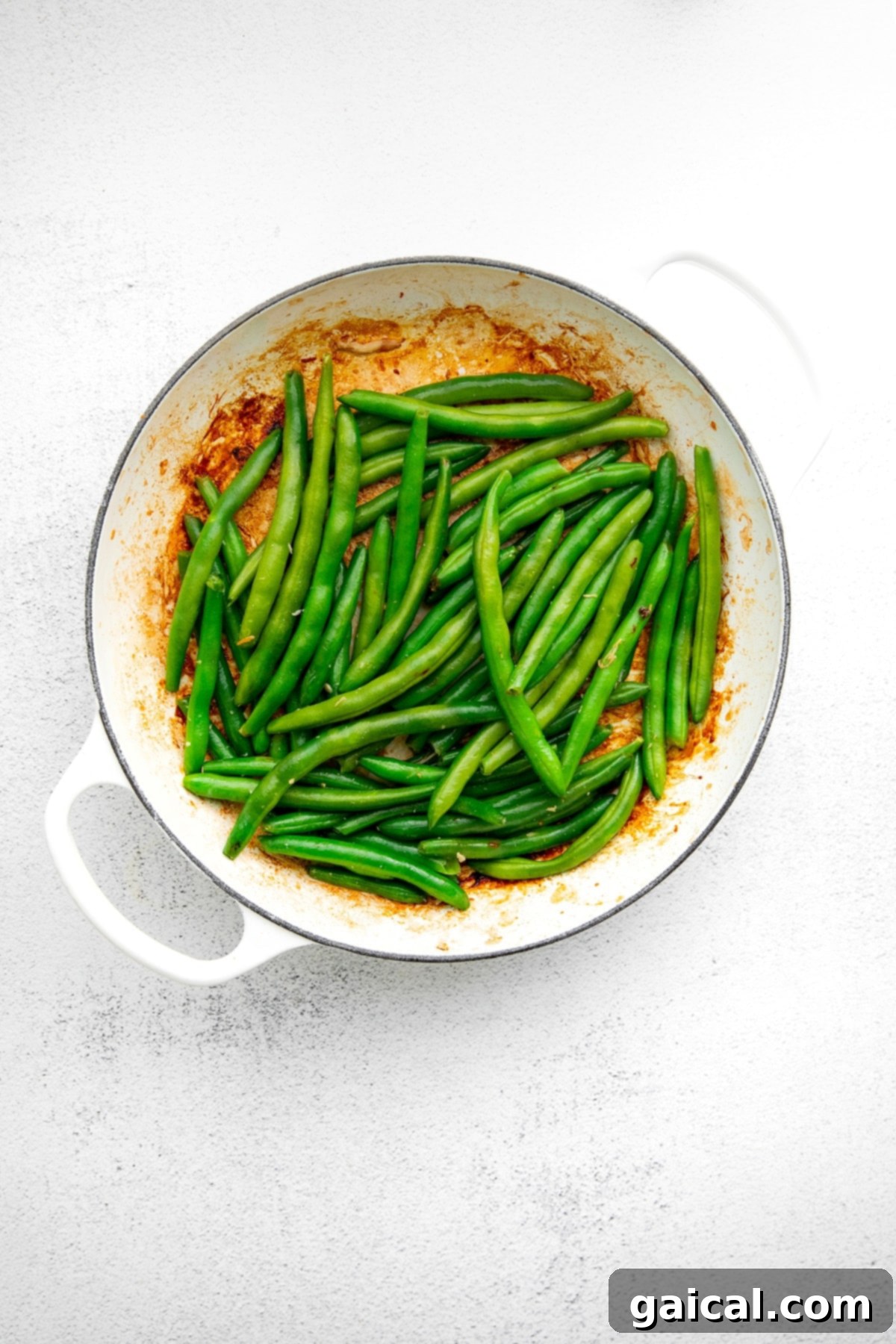 Crisp Green Beans for a Healthy Stir Fry Fresh green beans cooking in a hot pan, retaining their vibrant green color and crispness