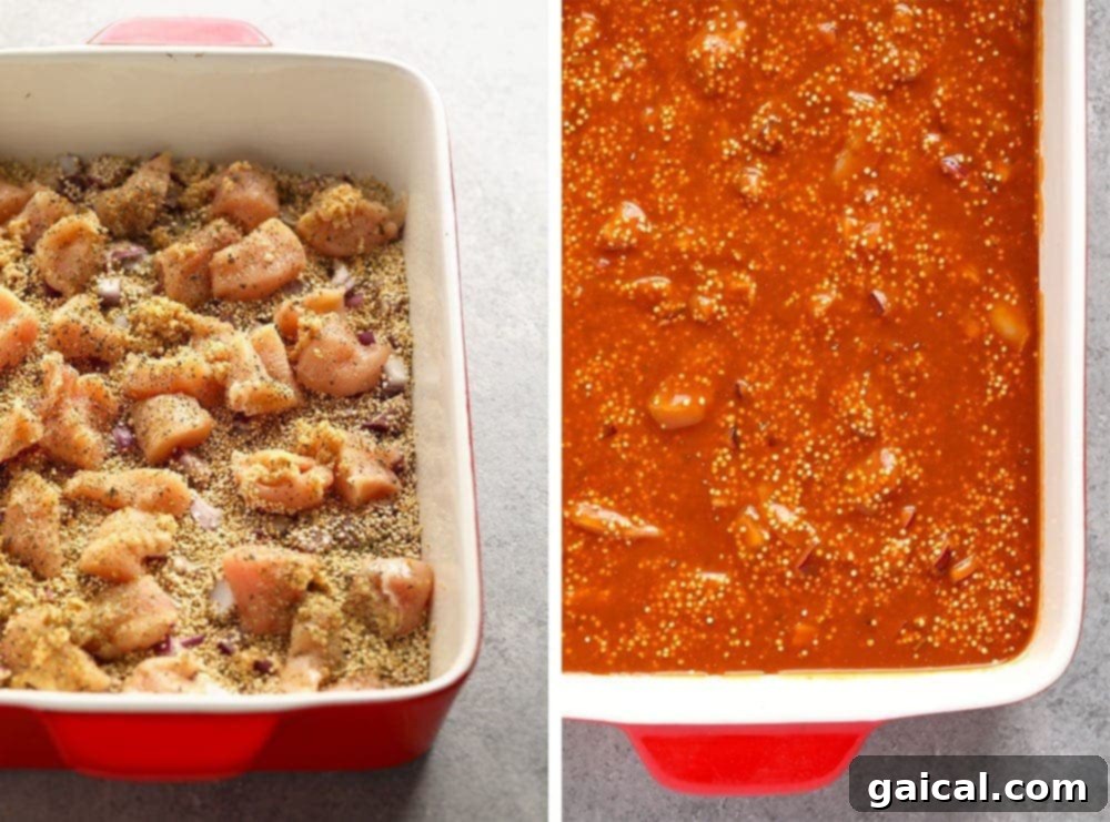 A vibrant Tuscan Chicken Quinoa Casserole in a baking dish, freshly baked with a golden crust, tomatoes, and melted mozzarella.