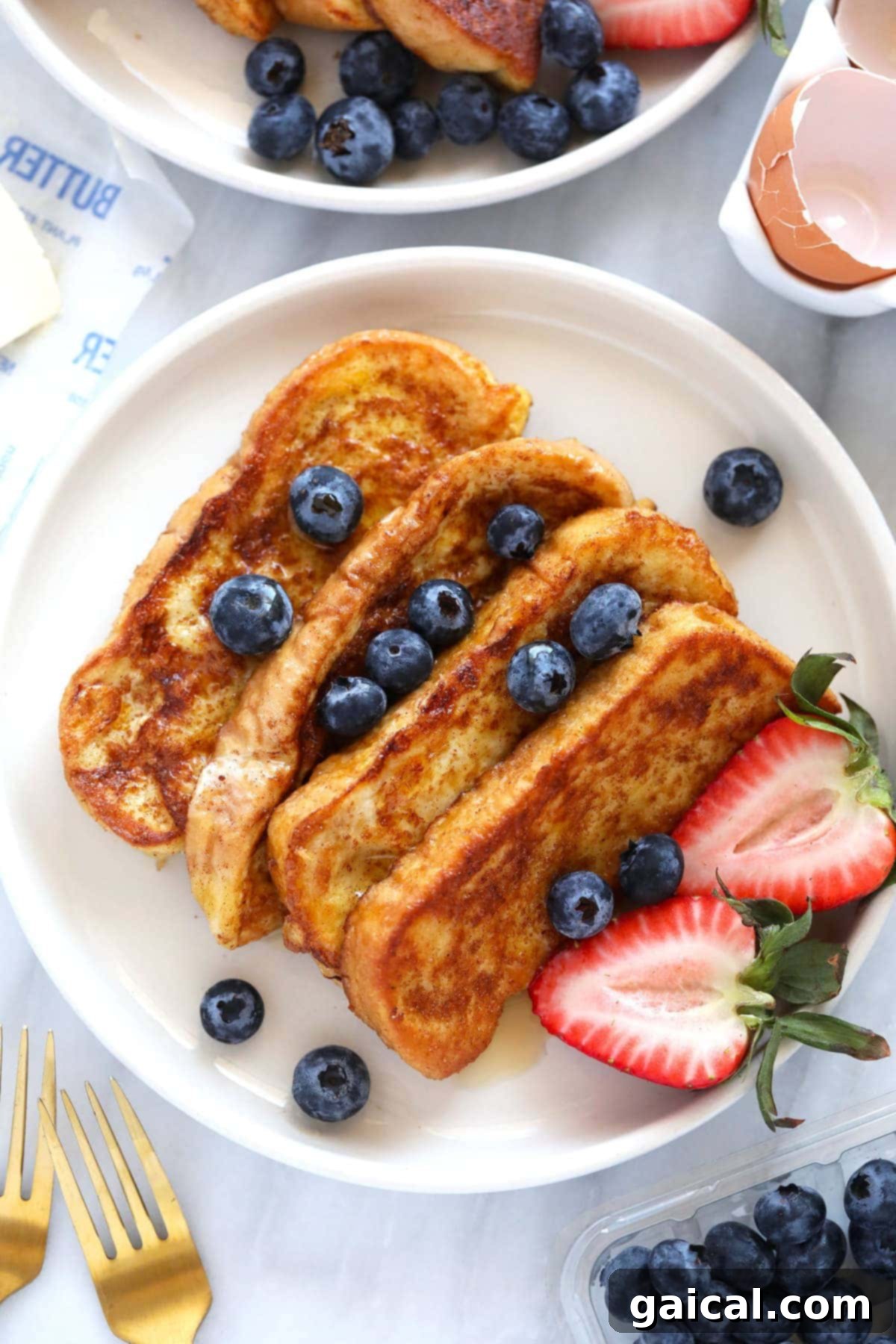 Golden brown French Toast Sticks topped with cinnamon sugar, a delicious and easy childhood classic breakfast recipe.