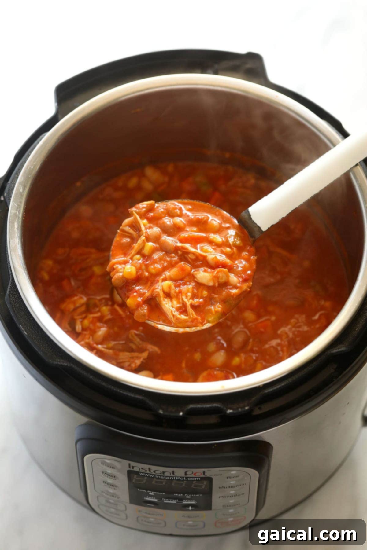 Zesty Instant Pot Buffalo Chicken Chili 6 A large serving of buffalo chicken chili, freshly made and ready to be served, showing its hearty texture.