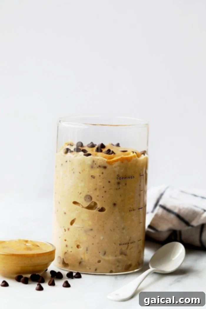 Delicious and Nutritious Peanut Butter Cookie Dough Overnight Oats Peanut Butter Chocolate Chip Cookie Dough Overnight Oats served beautifully in a glass jar, ready to be enjoyed.