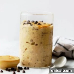 Peanut Butter Cookie Dough Overnight Oats in a jar, topped with chocolate chips.