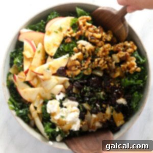 The Ultimate Thanksgiving Salad 2 A Thanksgiving salad featuring kale, apples, and walnuts, beautifully presented in a bowl.