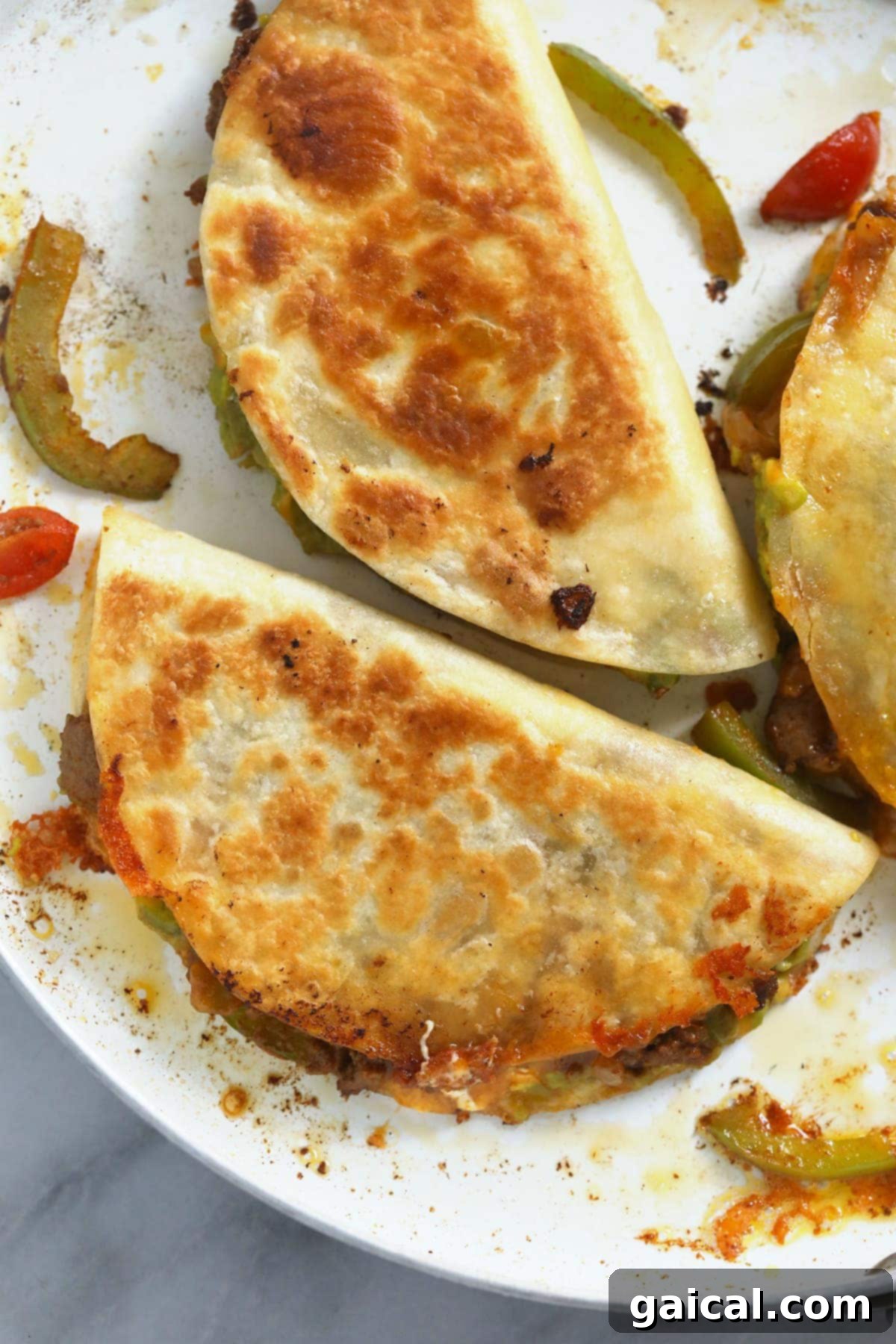 Golden-Grilled Chicken Queso 5 A chicken quesadilla sizzling in a hot skillet, golden brown and crispy, with melted cheese oozing slightly.
