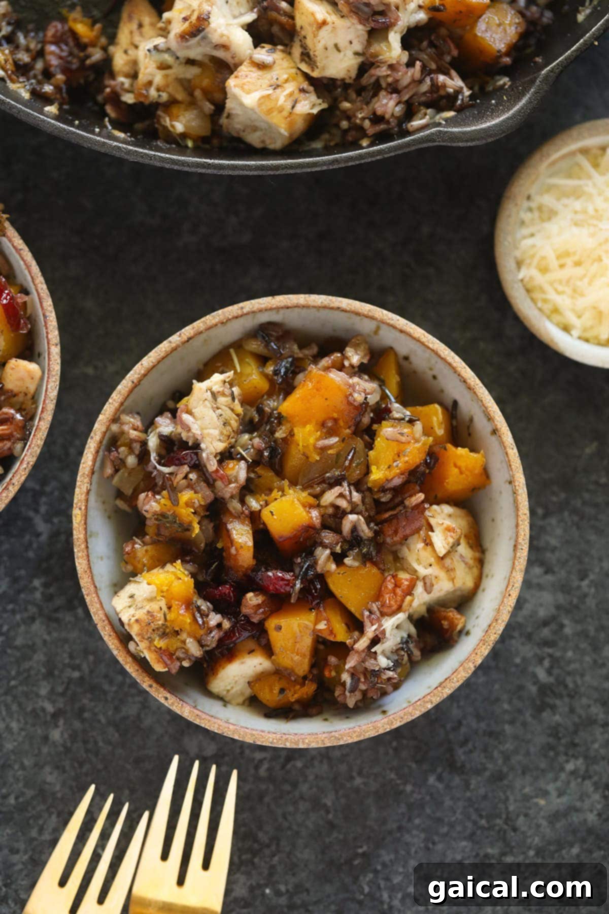A serving of Butternut Squash Wild Rice Casserole in a bowl, showcasing its rich texture and inviting fall colors.
