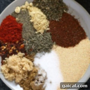 Universal Poultry Flavor Blend 6 A mix of all-purpose chicken seasoning displayed on a small white plate, ready for use.