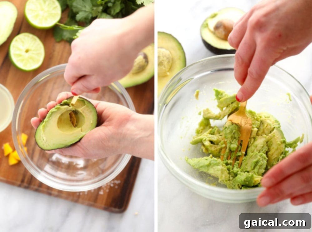 A close-up shot of a fork expertly mashing perfectly ripe avocado in a bowl, showcasing its creamy, vibrant green texture, an essential step for smooth and delicious guacamole.