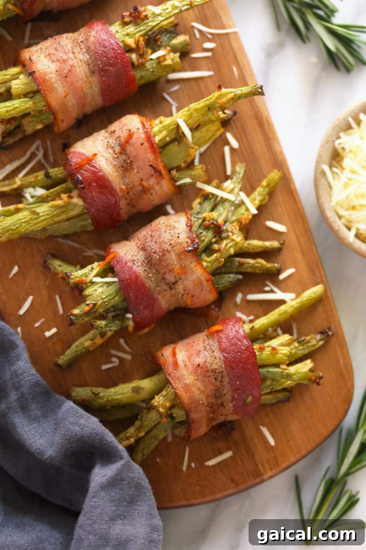 Elegant Bacon Wrapped Green Beans Platter A stunning wooden platter filled with freshly baked bacon wrapped green beans, artfully arranged for serving at a sophisticated dinner party or family gathering.
