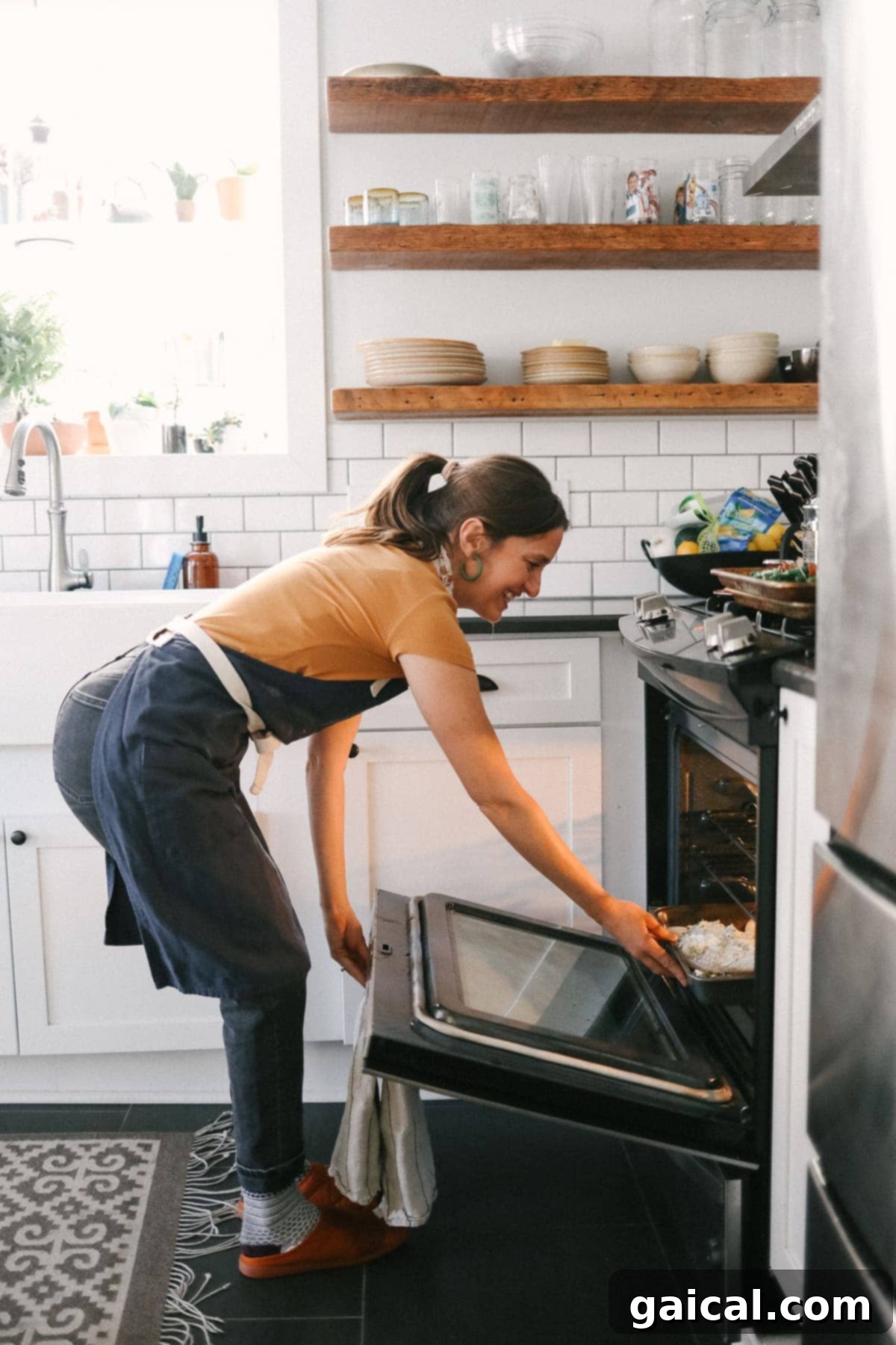 Putting a turkey in the oven, emphasizing early preparation