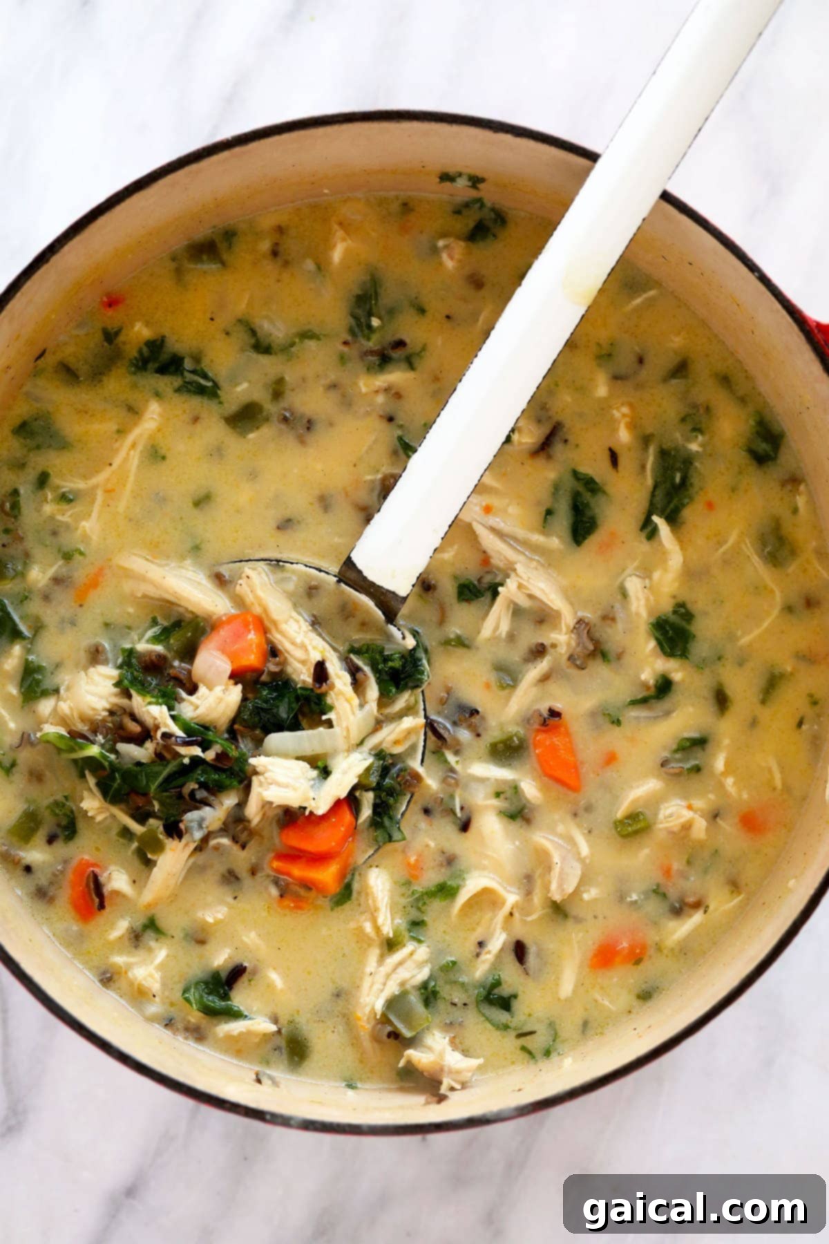Hearty Chicken Wild Rice Soup 8 Large pot of creamy chicken wild rice soup, ready to be served.