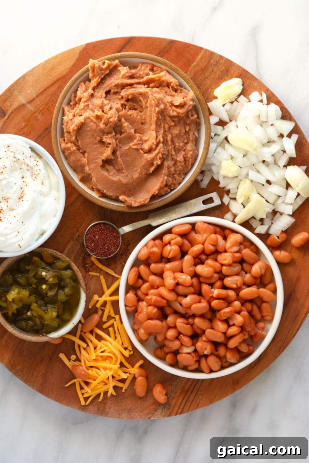 Fresh and vibrant ingredients for the bean dip, meticulously arranged and ready for mixing. bean dip ingredients ready to be mixed together