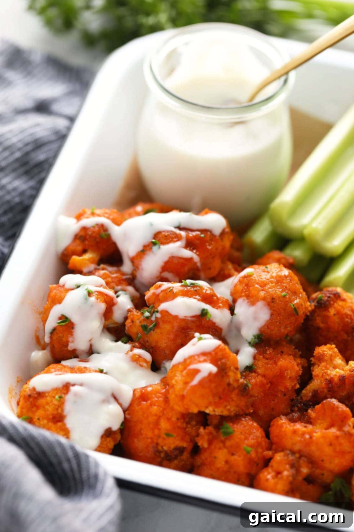 Delicious and crispy buffalo cauliflower wings cooked in an air fryer, served as the perfect appetizer.