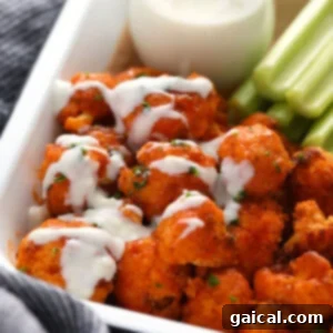 Air fryer buffalo cauliflower wings in a container, ready to serve.