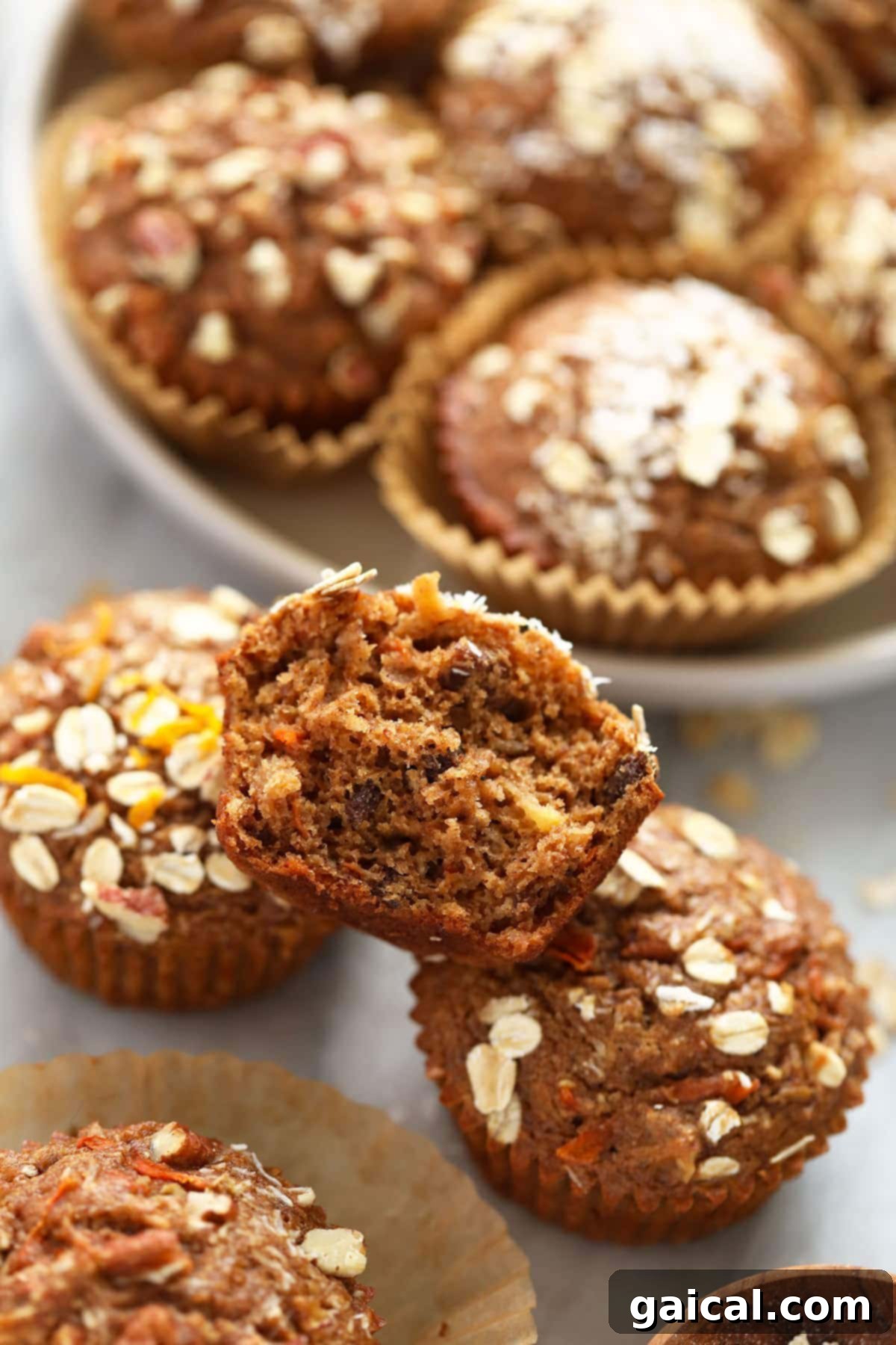 Sunrise Muffins 2 Beautifully baked Morning Glory Muffins arranged on a cooling rack.