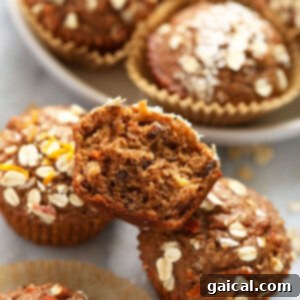 Batch of freshly baked Morning Glory muffins on a counter, ready to be enjoyed.