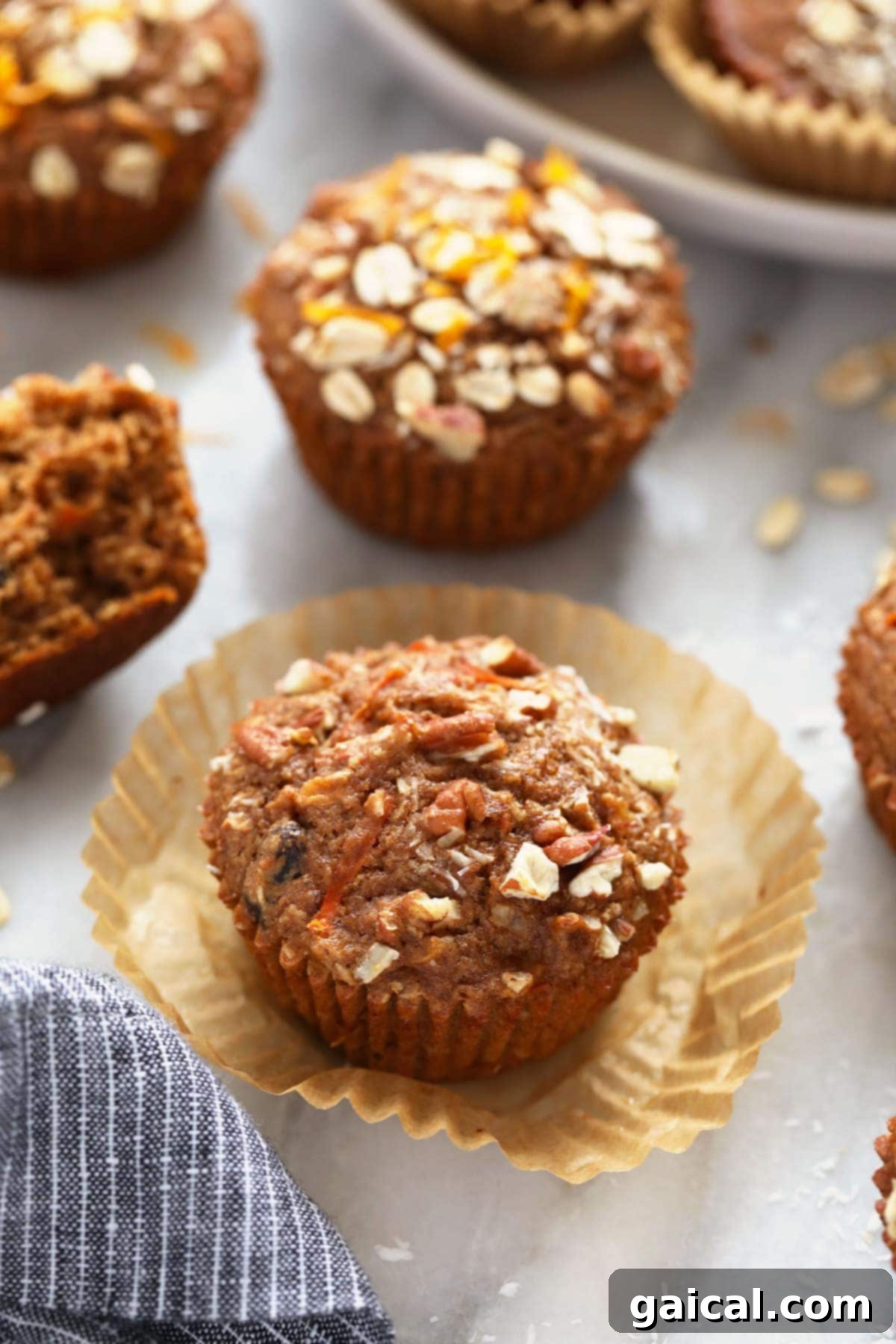 Sunrise Muffins 5 A freshly baked Morning Glory Muffin, topped with golden oats, ready to be enjoyed.
