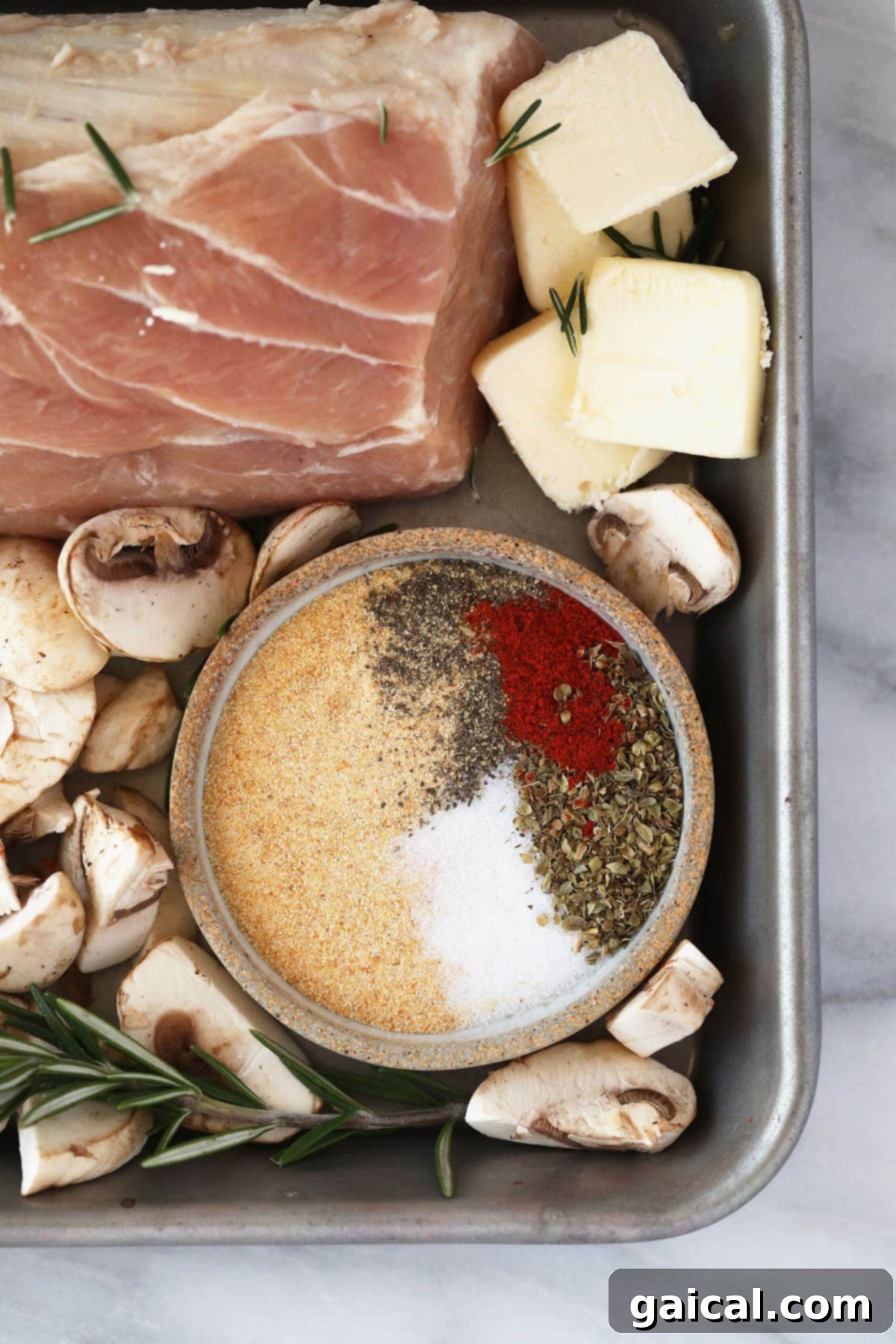 A small bowl filled with a blend of aromatic pork spices.