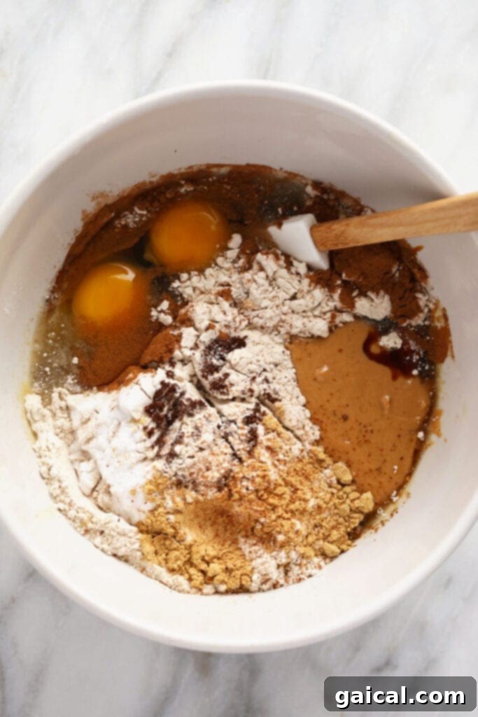 Spiced Gingerbread Bars 3 A bowl filled with the dry ingredients for gingerbread cookie bars, showcasing the wholesome components.