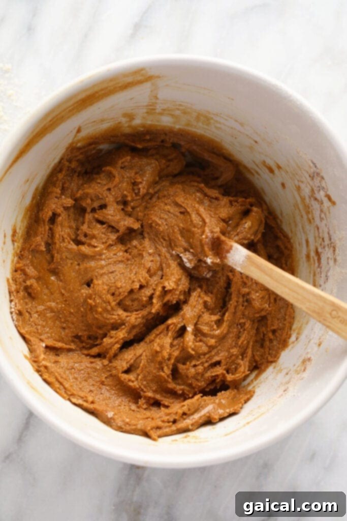 Spiced Gingerbread Bars 4 Gingerbread cookie bar batter freshly mixed in a bowl, ready for baking.