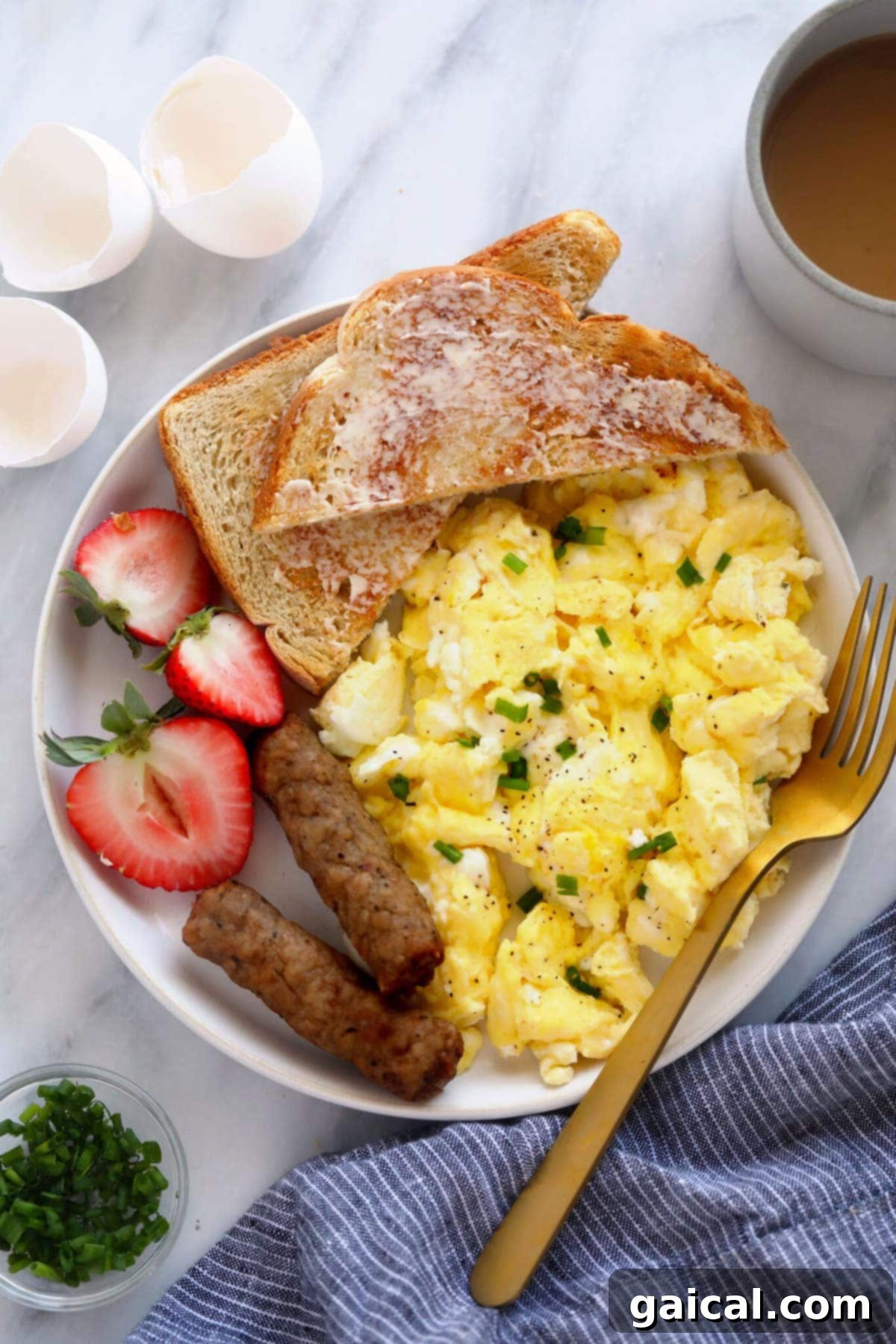 How to Make Fluffy Scrambled Eggs: The Perfect Recipe A vibrant plate featuring perfectly fluffy scrambled eggs, accompanied by fresh sliced fruit and golden-brown toast, highlighting a wholesome breakfast.