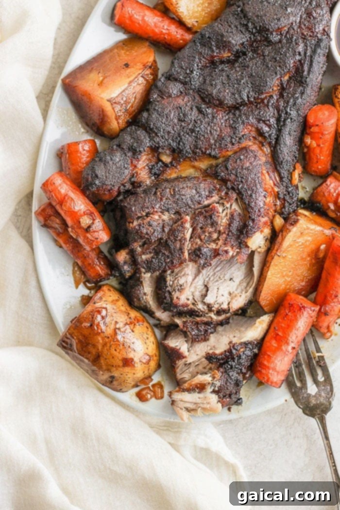 Succulent Slow Cooker Pork Roast A plate of slow cooker pork roast with gravy, ready to serve.