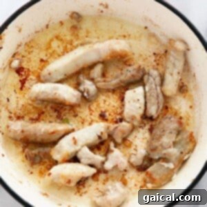 Luscious Honey Sticky Pork and 20 More Pork Recipes 7 Pork searing in a hot skillet.