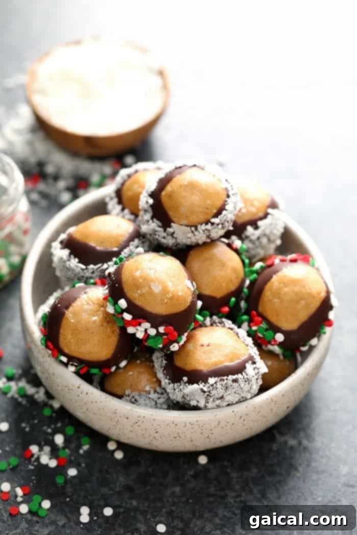 Guilt-Free Protein Buckeye Bites 2 Healthy peanut butter balls in a bowl with sprinkles.
