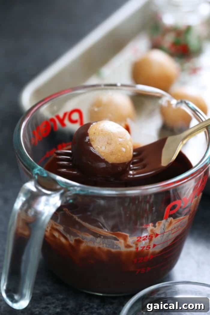 Guilt-Free Protein Buckeye Bites 3 A measuring cup filled with rich, indulgent chocolate.