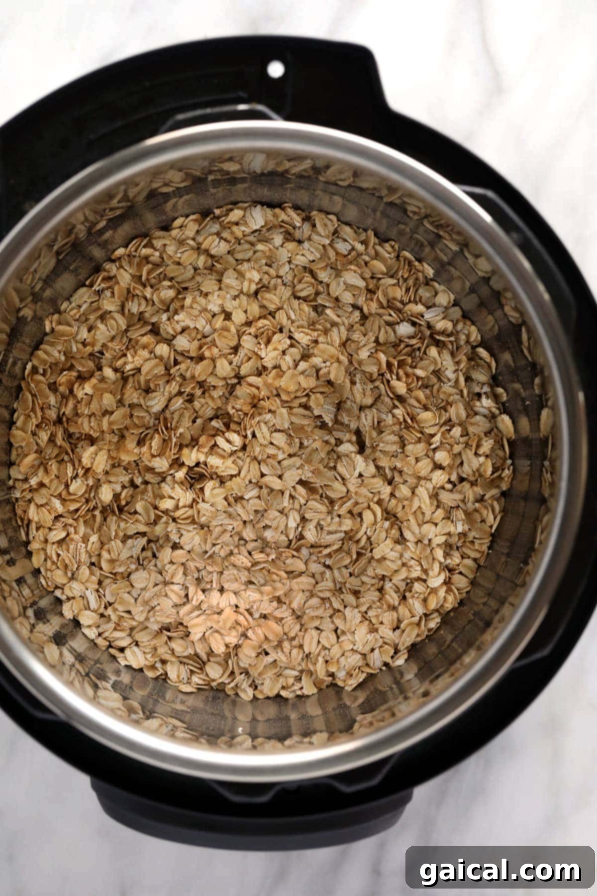 Instant Pot Oatmeal is a healthy breakfast packed with fiber and protein. This Instant Pot Oatmeal recipe is naturally vegan and gluten-free! Rolled oats, almond milk, maple syrup, and salt already combined in the Instant Pot inner pot, ready for cooking.