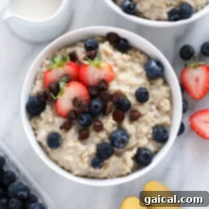 A beautifully garnished bowl of Instant Pot oatmeal, capturing its creamy texture and inviting appearance.