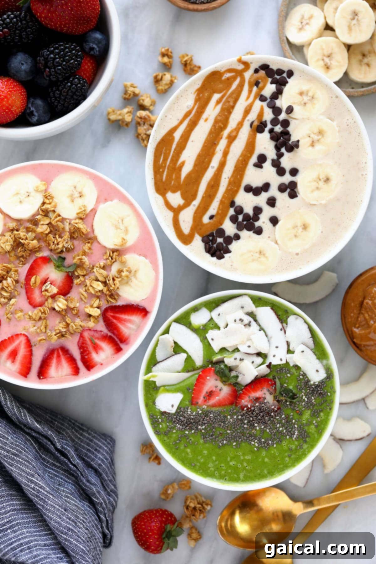 Smoothie Bowl Variations 2 Three beautifully garnished smoothie bowls, showcasing a variety of vibrant colors and fresh toppings like berries, granola, and seeds.