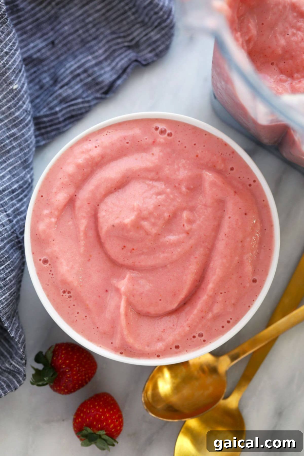 Smoothie Bowl Variations 4 A vibrant strawberry smoothie bowl topped with fresh berries, granola, and banana slices, ready to be enjoyed as a wholesome meal.