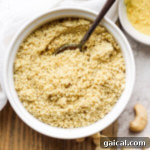 Close-up of a bowl of homemade vegan parmesan cheese, light and crumbly.