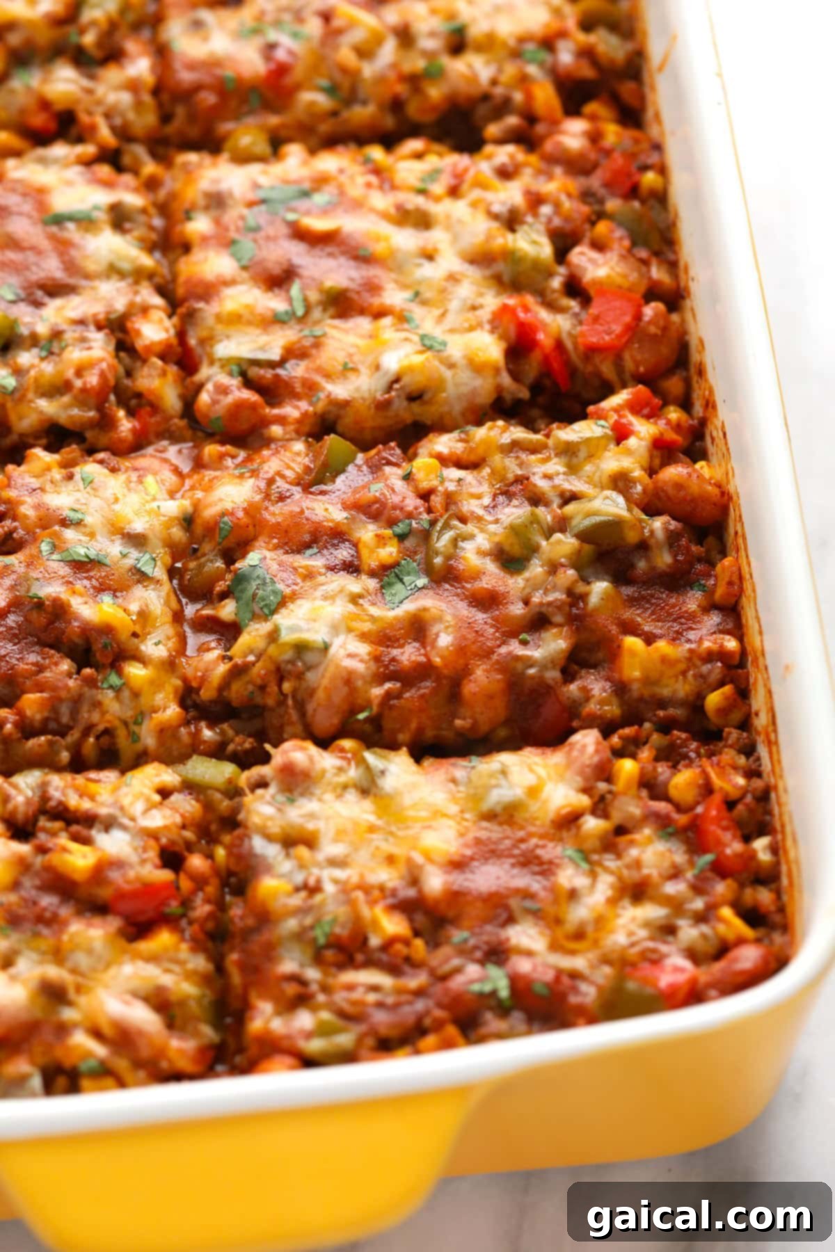 Baked Mexican casserole sliced into perfect, hearty pieces, ready to be served.