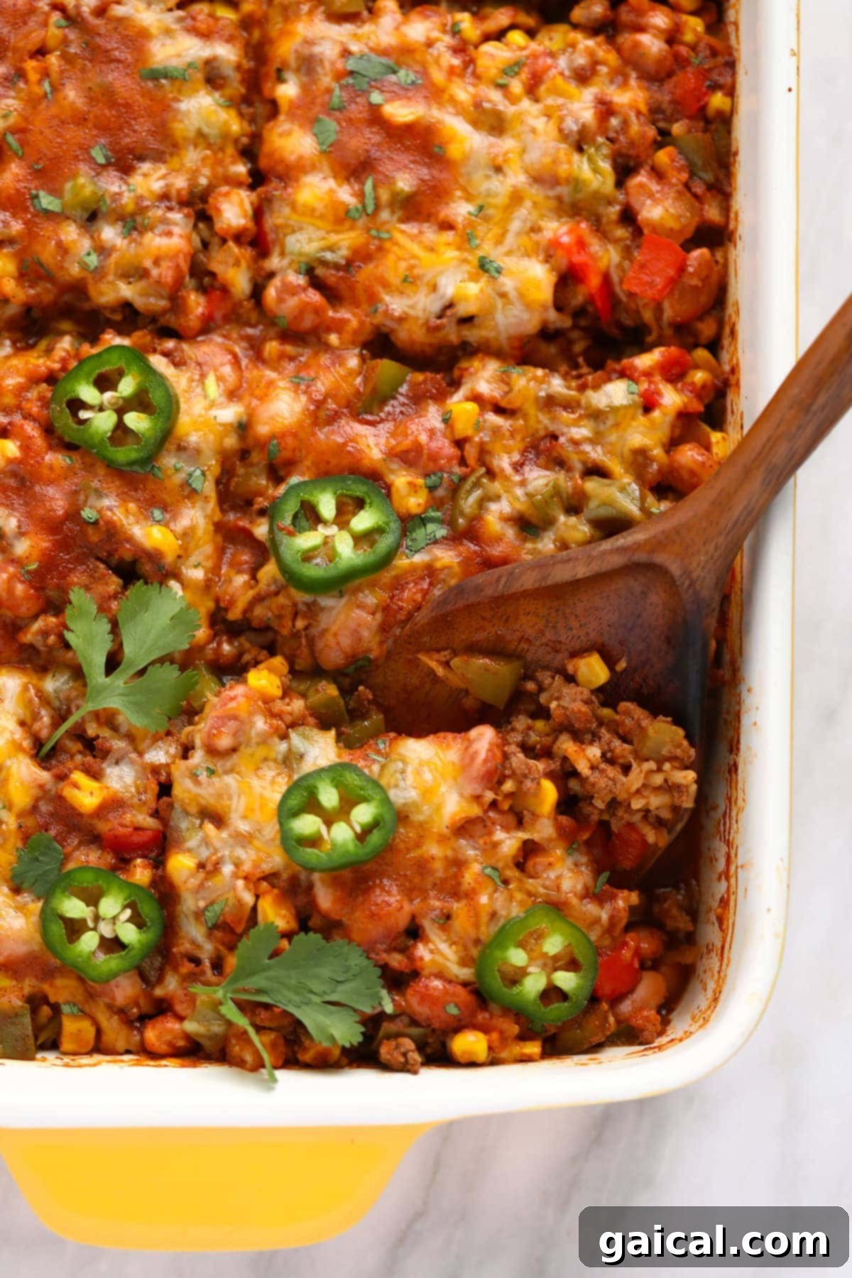 Mexican beef casserole in a bowl, showing the rich texture and delicious ingredients.