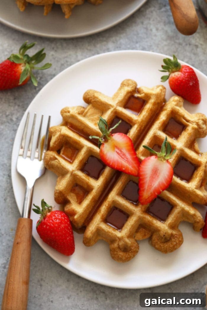 Fluffy Protein Waffles: A Healthy High-Protein Breakfast Solution Healthy protein waffles on a plate with fresh berries and syrup