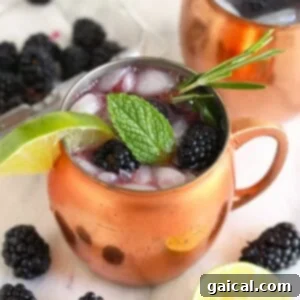 A Moscow Mule served in a classic copper mug, garnished with a lime wedge, inspiring thoughts of refreshing cocktails.